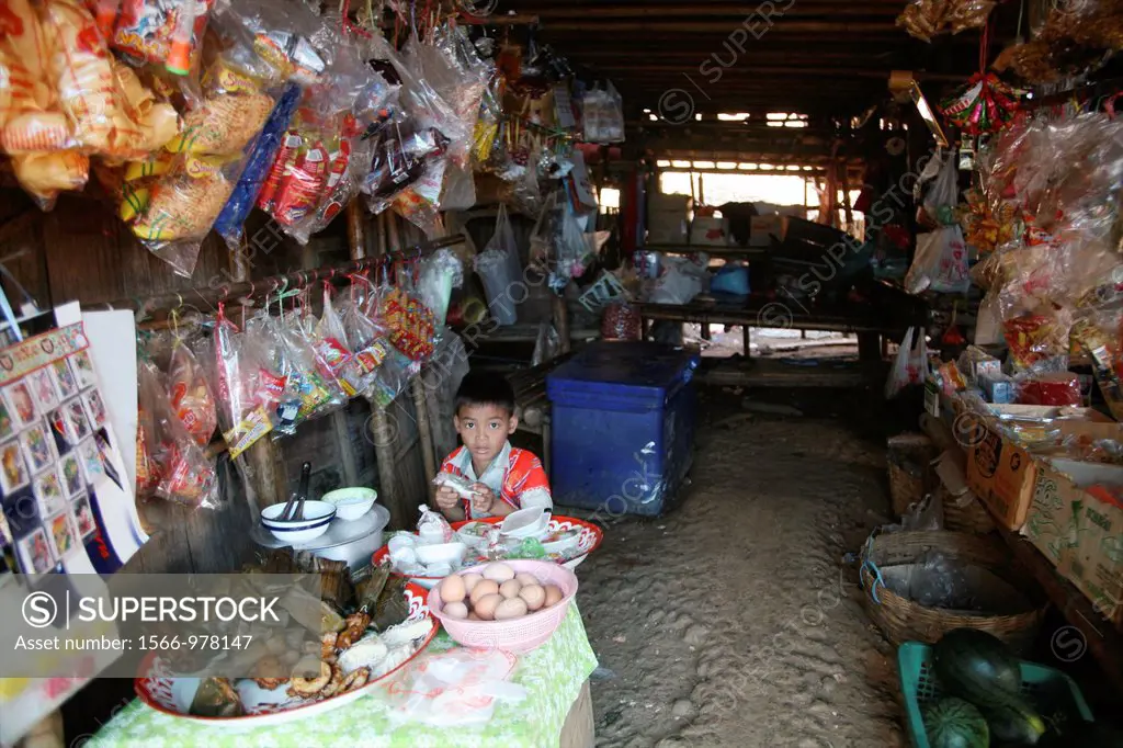 Boy at a toy store in Mae Sot Around 130,000 Burmese refugees have settled in Thailand due to opression in their homeland of Myanmar Burma Approximate...