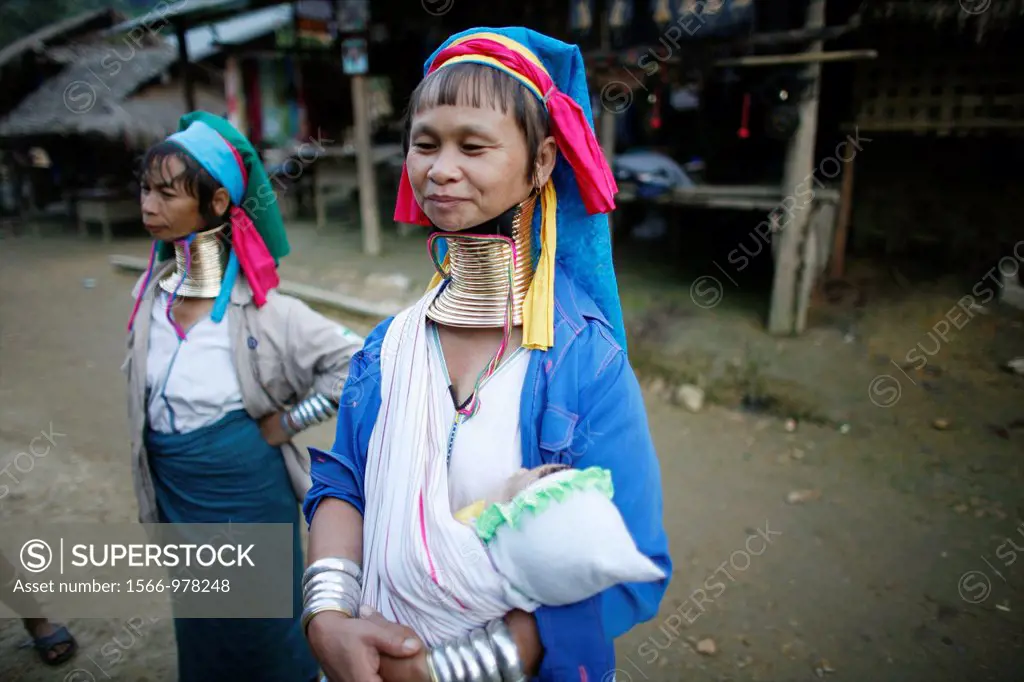 Closeup of a Longneck woman holding her baby in the village Approximately 300 Burmese refugees in Thailand are members of the indigenous group known a...