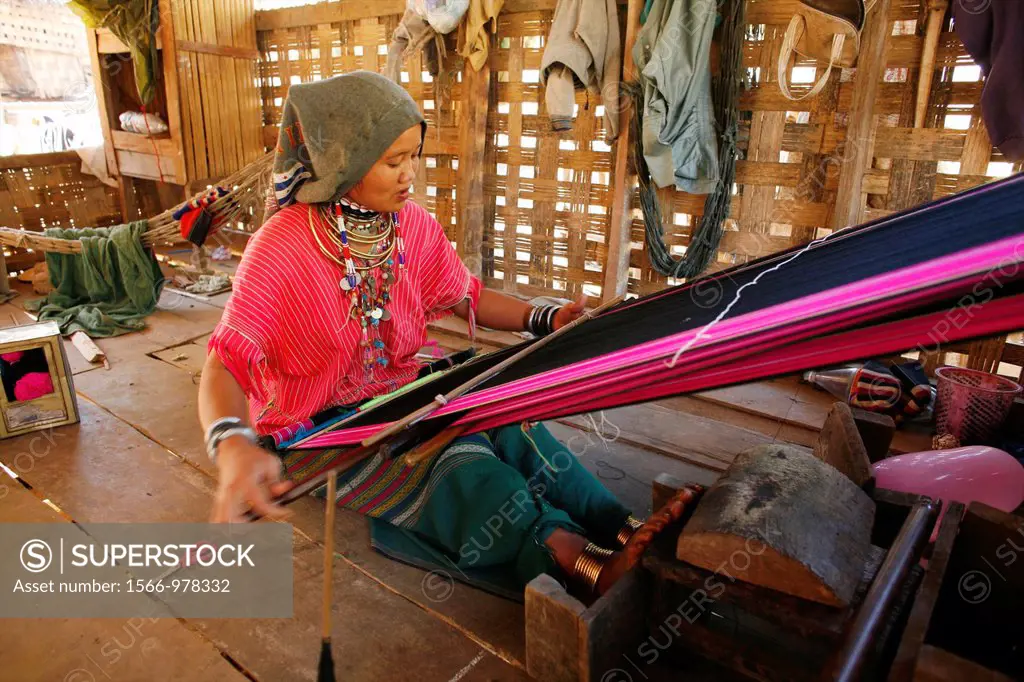 A Longneck woman weaving in the refugee camp Approximately 300 Burmese refugees in Thailand are members of the indigenous group known as the Longnecks...