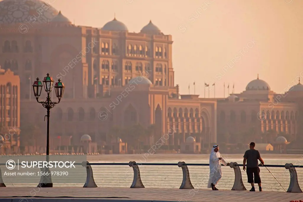 evening mood at the waterfront promenade in front of the Emirates Palace, a luxury hotel in Abu Dhabi, United Arab Emirates, Asia
