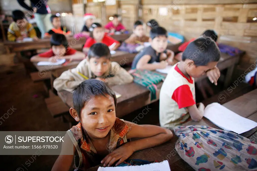 Burmese children at school in La Per Her In Myanmar Burma, thousands of people have settled near the border as a result of oppression in their homelan...