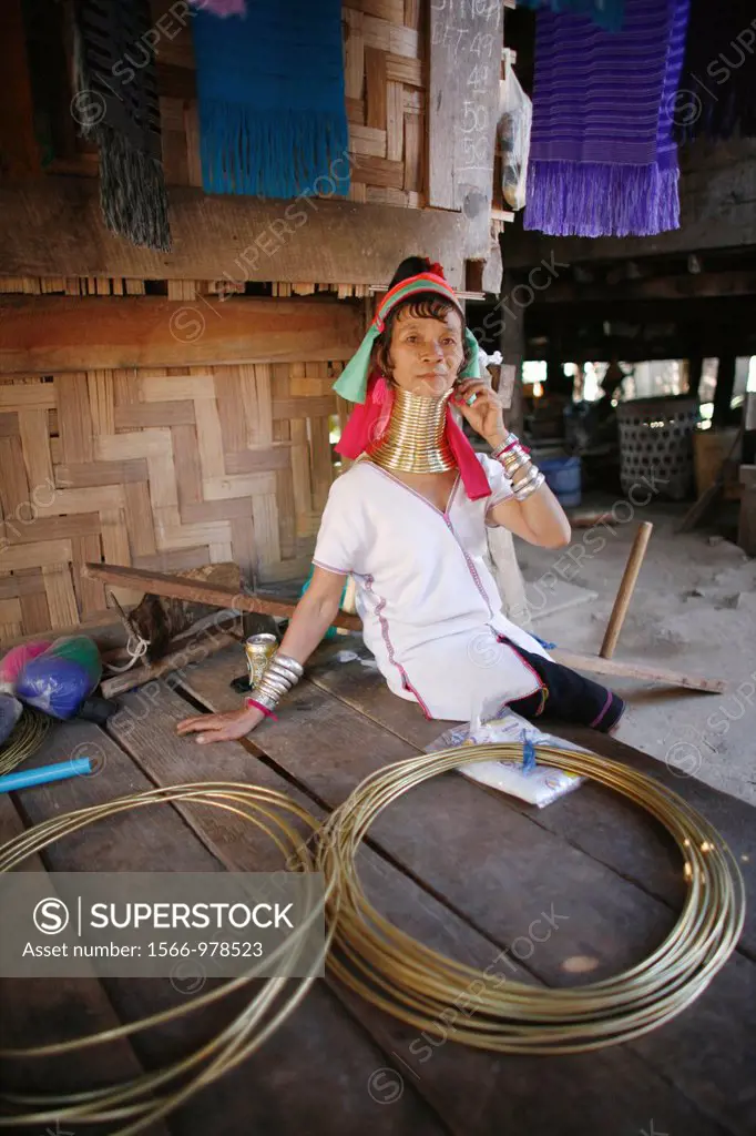A Longneck woman poses with the metal coils used around the neck Approximately 300 Burmese refugees in Thailand are members of the indigenous group kn...