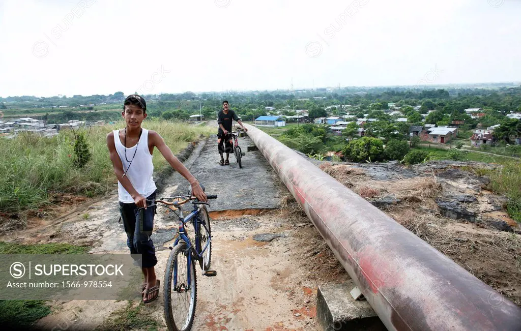 Oil pipeline near a slum in Barrancabermeja