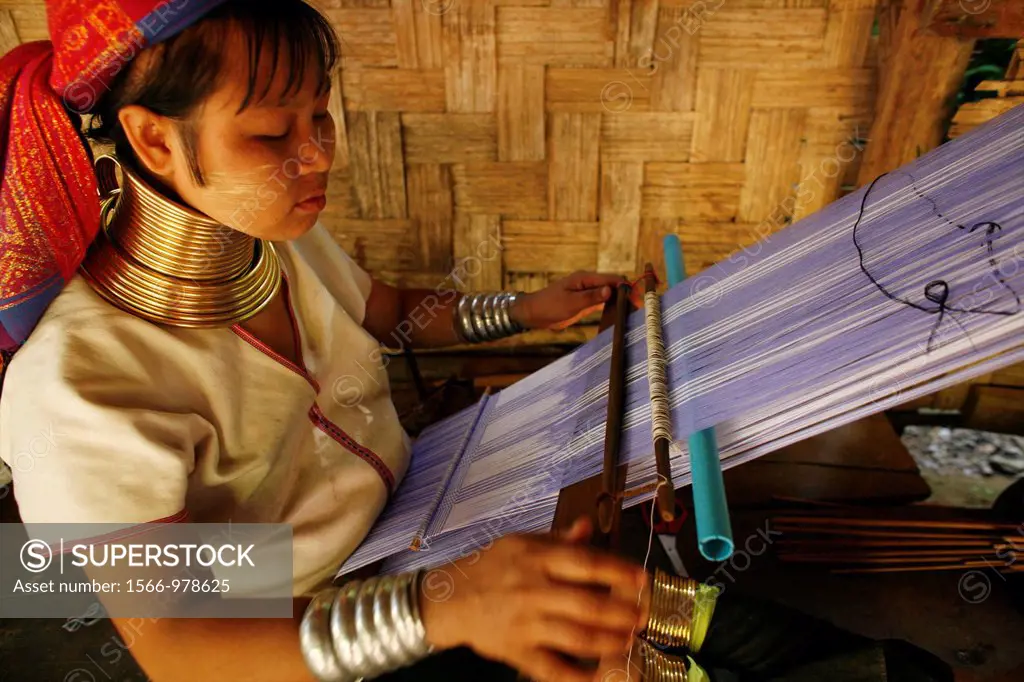 Closeup of Longneck woman weaving Approximately 300 Burmese refugees in Thailand are members of the indigenous group known as the Longnecks The larges...