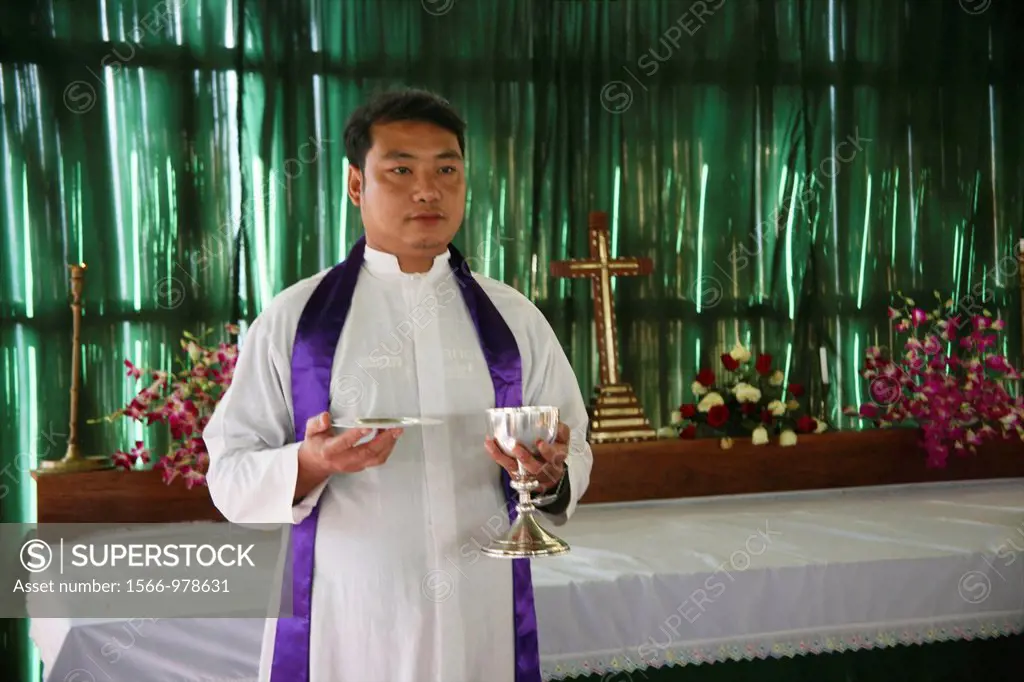 A priest celebrates mass at the refugee camp Anglican church in Mae Sot Around 130,000 Burmese refugees have settled in Thailand due to opression in t...