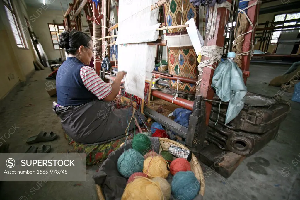 Tibetan women working in a carpet weavery in Nepal Most carpets are being exported to the West
