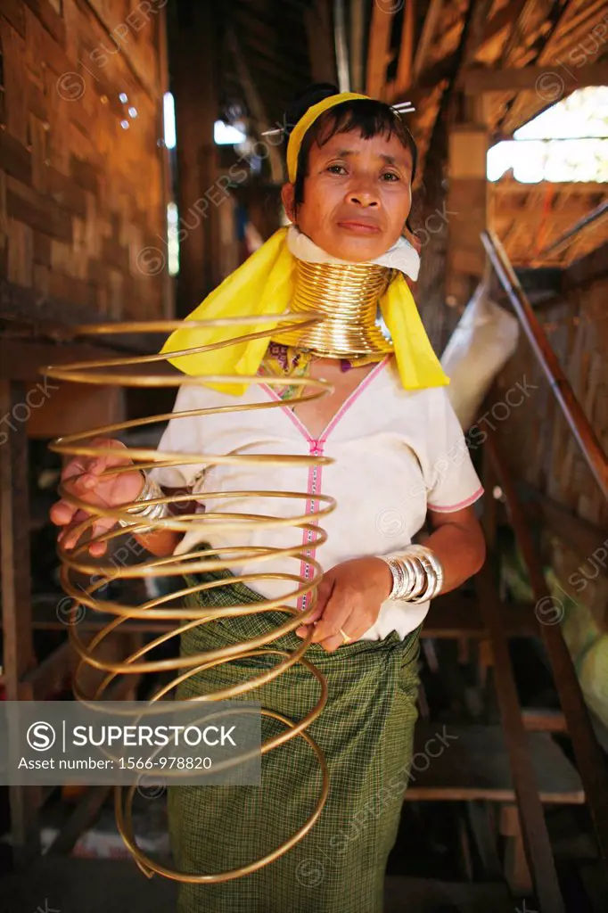 A Longneck woman displays the coiled metal worn around the neck Approximately 300 Burmese refugees in Thailand are members of the indigenous group kno...
