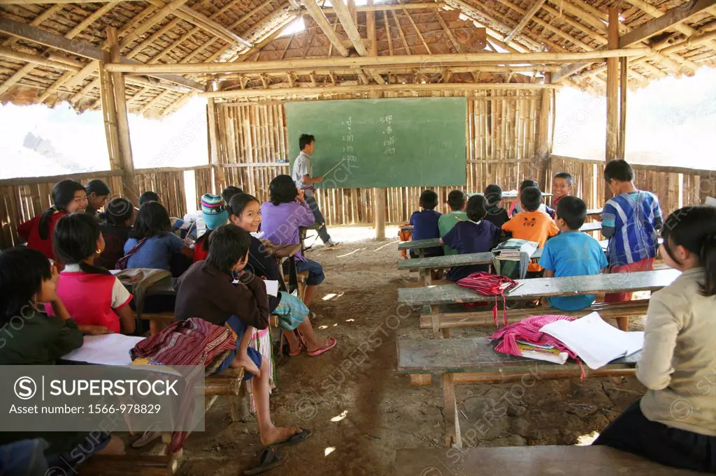 A teacher instructs pupils at a primary school in Mae Sot refugee camp Around 130,000 Burmese refugees have settled in Thailand due to opression in th...