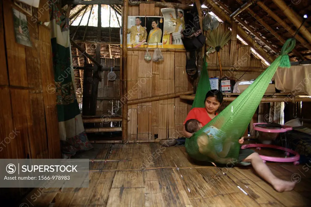 Interior of a hut used by a displaced family In Myanmar Burma, thousands of people have settled near the border as a result of oppression in their hom...