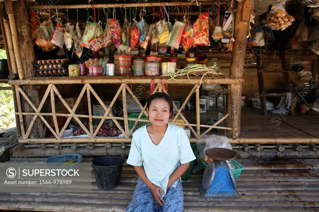 A shopkeeper in front of her store in a displaced persons camp near the border with Thailand In Myanmar Burma, thousands of people have settled near t...