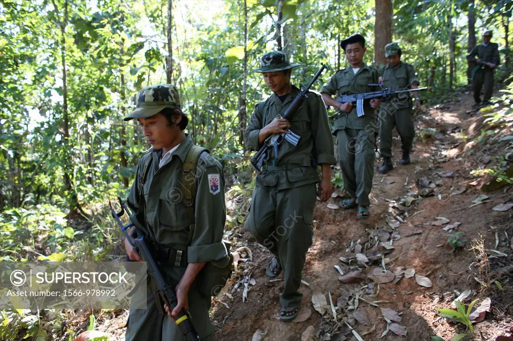 KNLA soldiers in a line near the border with Thailand In Myanmar Burma, thousands of people have settled near the border as a result of oppression in ...