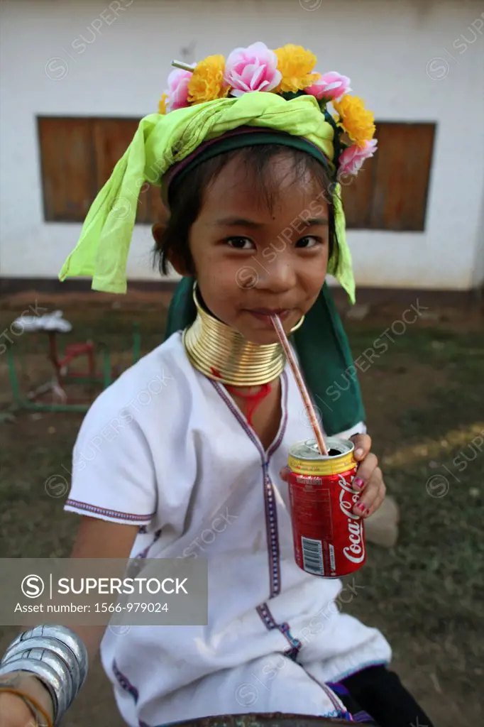A young Longneck girls drinks a Coke Approximately 300 Burmese refugees in Thailand are members of the indigenous group known as the Longnecks The lar...