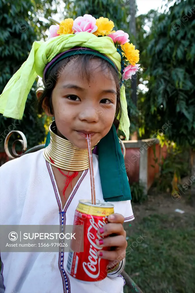 Closeup of a Longneck girl drinking a Coke Approximately 300 Burmese refugees in Thailand are members of the indigenous group known as the Longnecks T...