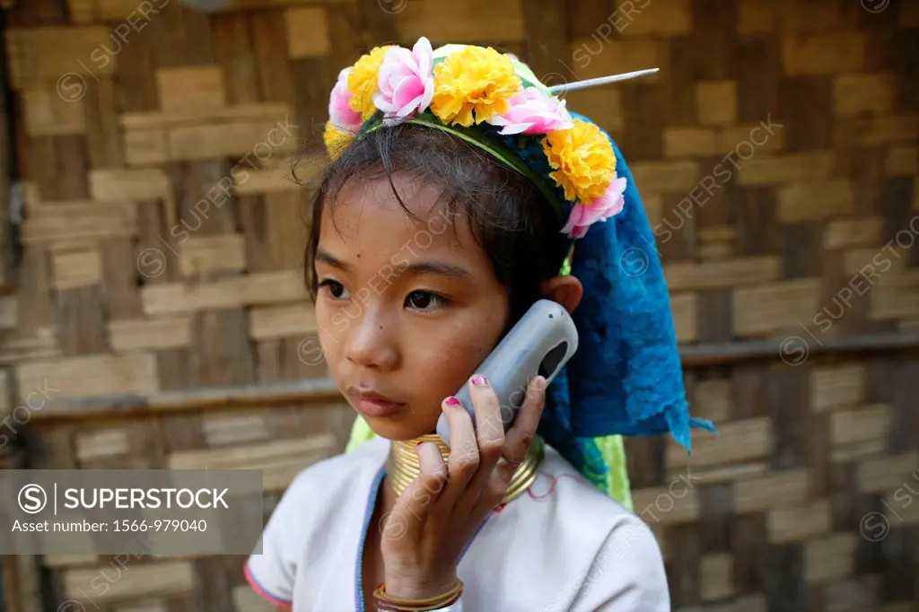 A Longneck girl listens to a cell phone Approximately 300 Burmese refugees in Thailand are members of the indigenous group known as the Longnecks The ...