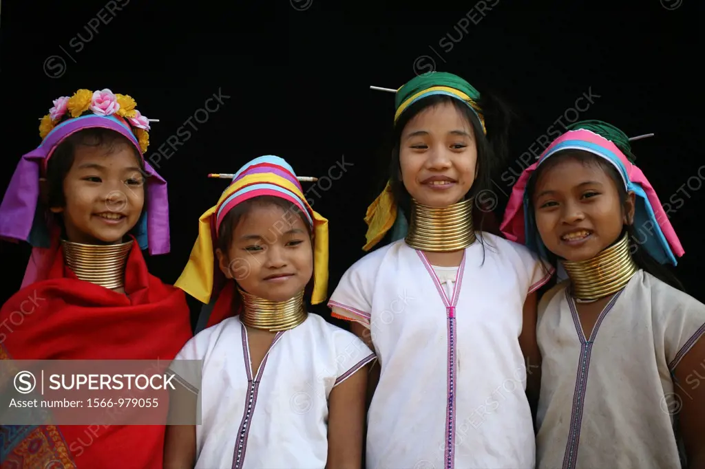 Closeup of four Longneck girls Approximately 300 Burmese refugees in Thailand are members of the indigenous group known as the Longnecks The largest o...