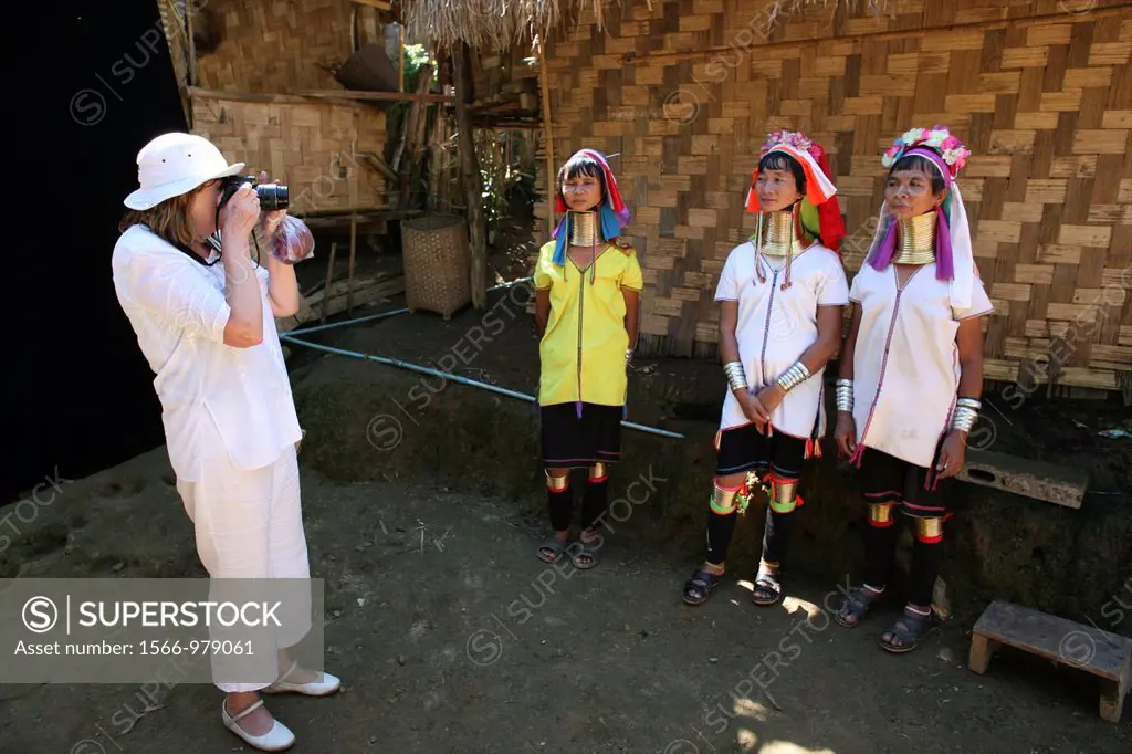 A Western tourist takes a photo of Longneck women Approximately 300 Burmese refugees in Thailand are members of the indigenous group known as the Long...
