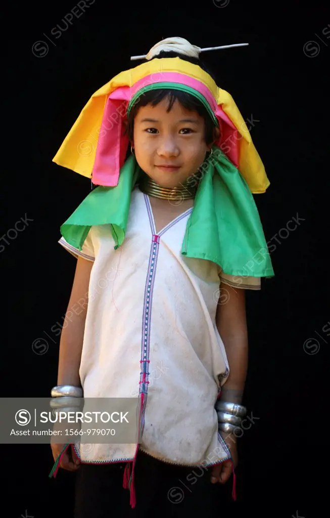 Portrait of a young, smiling Longneck girl Approximately 300 Burmese refugees in Thailand are members of the indigenous group known as the Longnecks T...