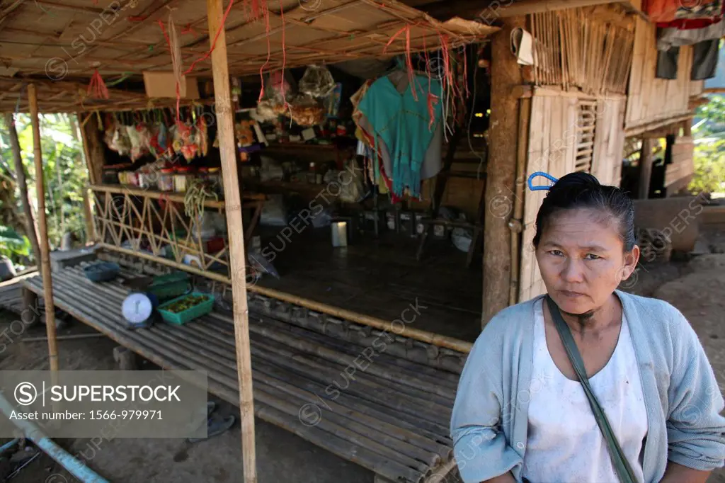 A Burmese woman outside a shop selling supplies in the displaced persons camp In Myanmar Burma, thousands of people have settled near the border as a ...