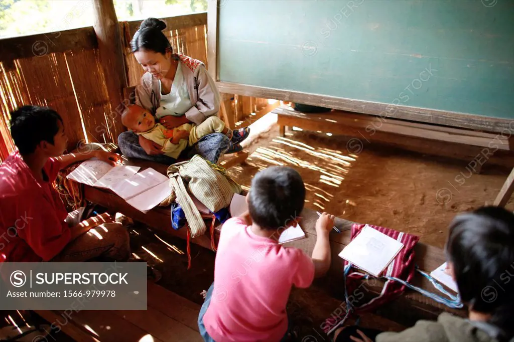 A teacher with her baby at the La Per Her village school in Myanmar In Myanmar Burma, thousands of people have settled near the border as a result of ...
