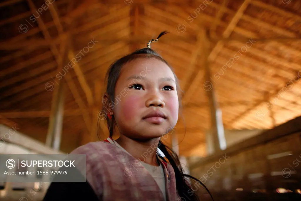 Portrait of a young girl at the village school in La Per Her In Myanmar Burma, thousands of people have settled near the border as a result of oppress...