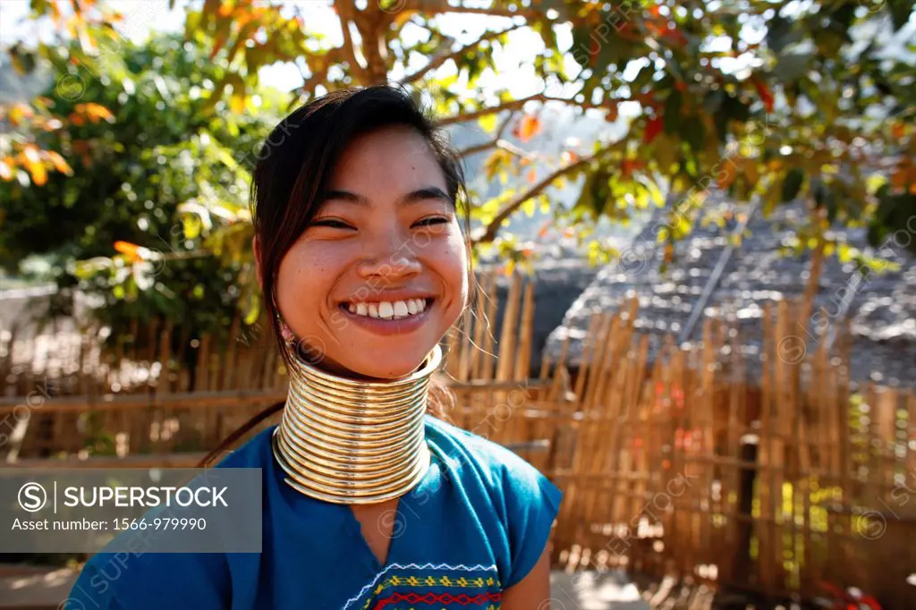 Smiling Longneck girl outdoors Approximately 300 Burmese refugees in Thailand are members of the indigenous group known as the Longnecks The largest o...