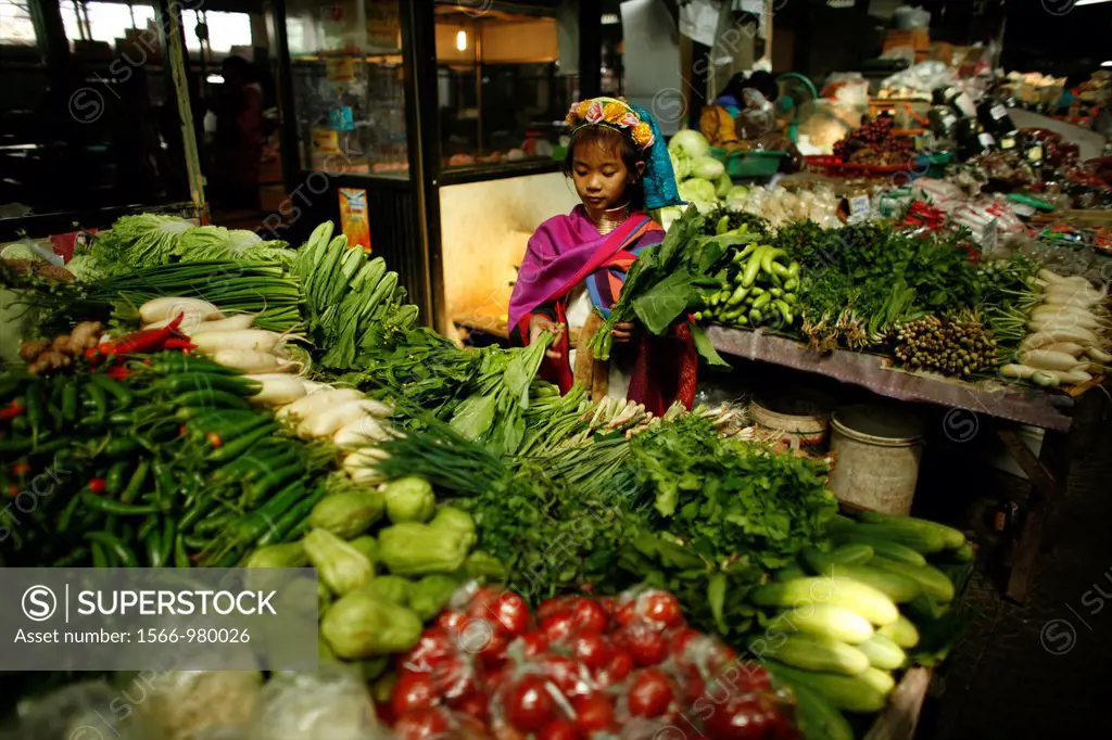 A Longneck girl at a vegetable market Approximately 300 Burmese refugees in Thailand are members of the indigenous group known as the Longnecks The la...