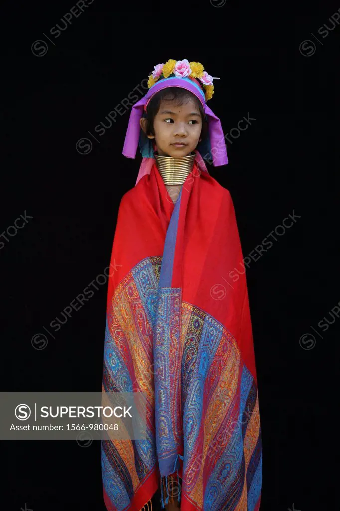 Portrait of a young Longneck girl wrapped in a scarf Approximately 300 Burmese refugees in Thailand are members of the indigenous group known as the L...