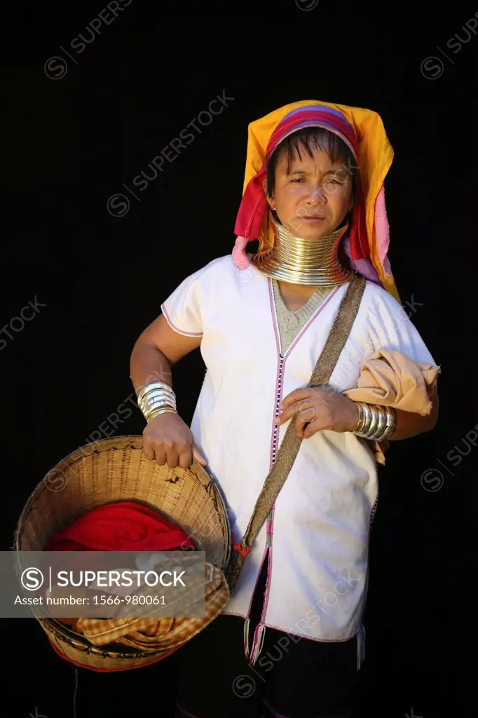 Portrait of Longneck woman carrying a basket Approximately 300 Burmese refugees in Thailand are members of the indigenous group known as the Longnecks...