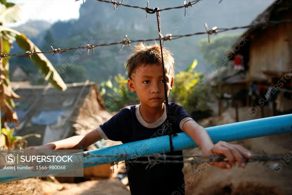 Young refugee boy in Mae Sot Around 130,000 Burmese refugees have settled in Thailand due to opression in their homeland of Myanmar Burma Approximatel...