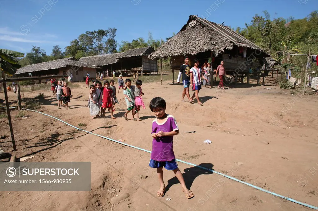 People walking in the displaced persons camp near the border with Thailand In Myanmar Burma, thousands of people have settled near the border as a res...