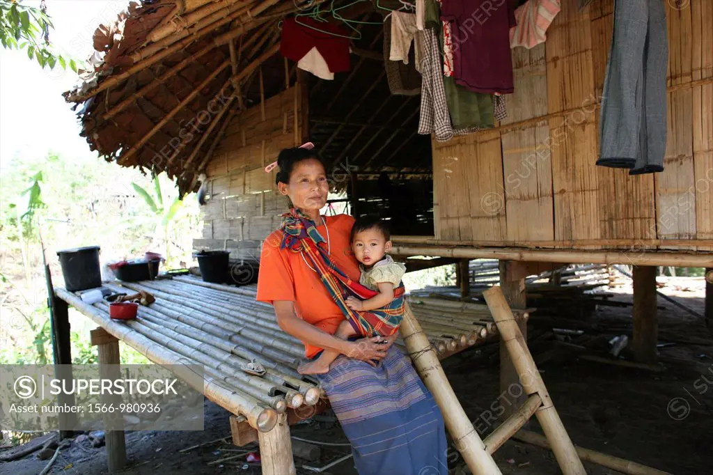 A woman with her baby in the displaced persons camp near the Thai border In Myanmar Burma, thousands of people have settled near the border as a resul...