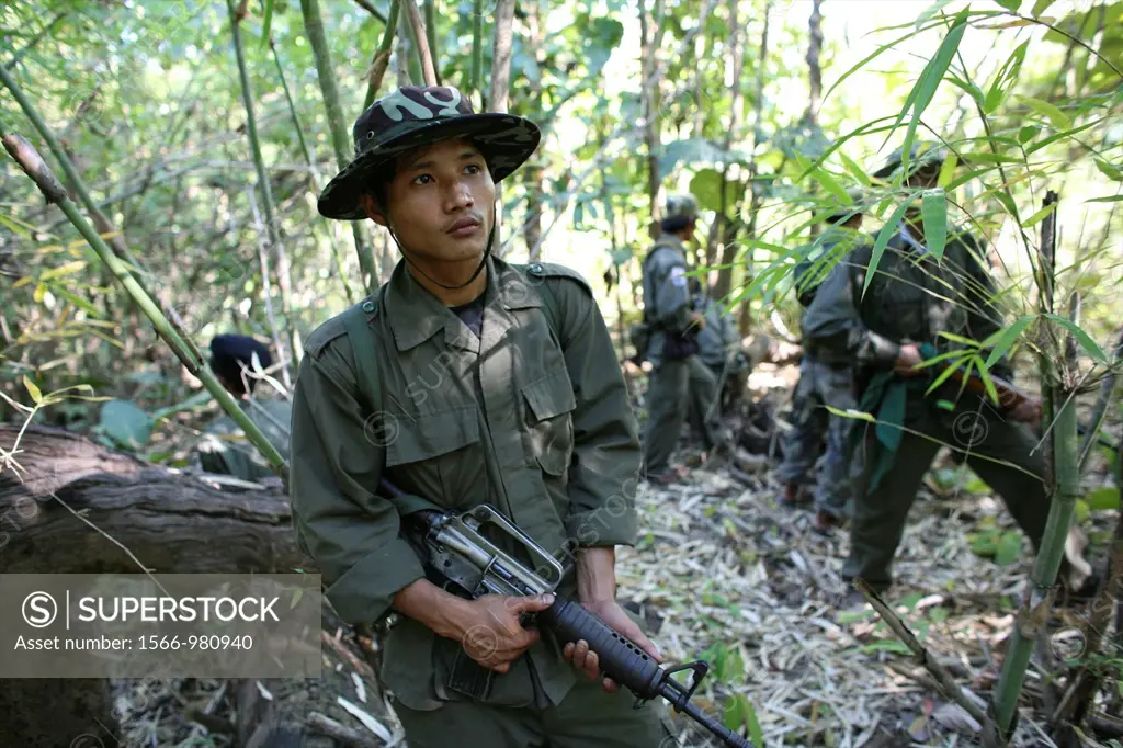 A KNLA soldier resting in the jungle near Thailand In Myanmar Burma, thousands of people have settled near the border as a result of oppression in the...