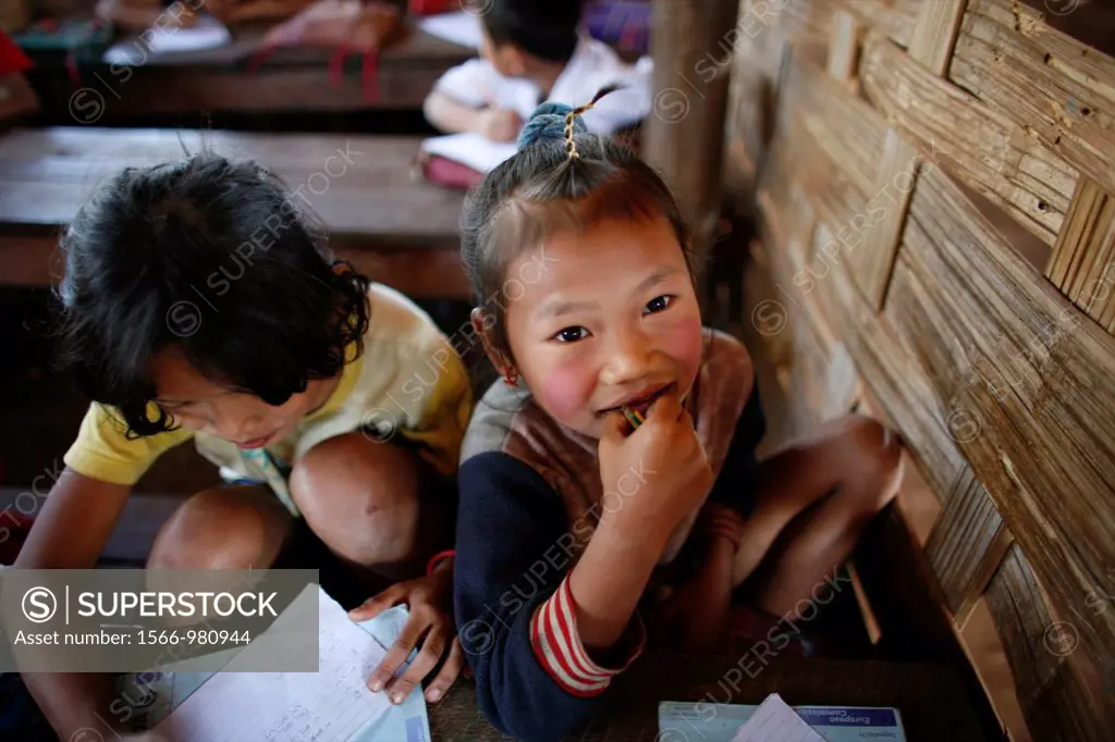 Burmese children at a village school in La Per Her In Myanmar Burma, thousands of people have settled near the border as a result of oppression in the...