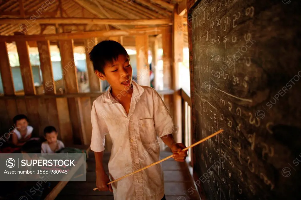 A young teacher at the school for Burmese children in La Per Her In Myanmar Burma, thousands of people have settled near the border as a result of opp...