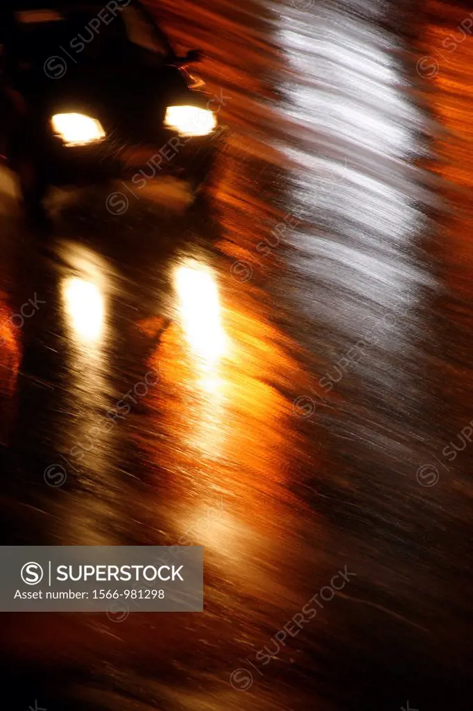 fast car driving in heavy rain at night in town