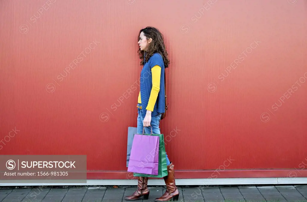 Young woman outdoors with shopping bags