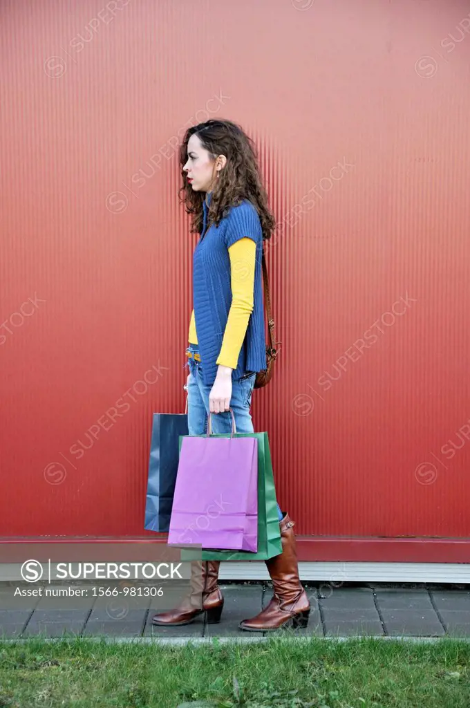 Young woman outdoors with shopping bags