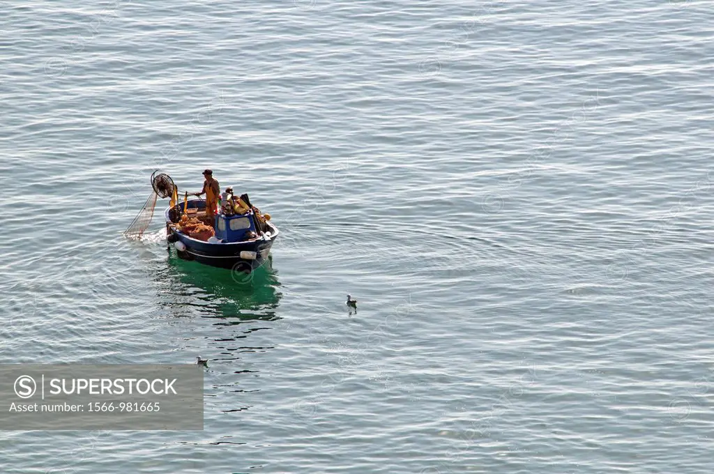 traditional, old fashioned way of fishing from the small boat, Amalfi Coast, Campania region, southern Italy, Mediterranean Sea