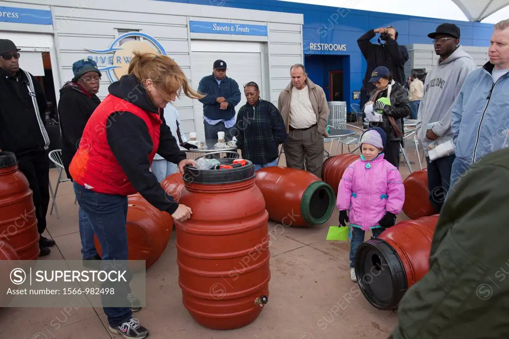 Detroit, Michigan - A workshop sponsored by the Sierra Club helps Detroit residents make rain barrels  Rain barrels collect rain water for later use o...