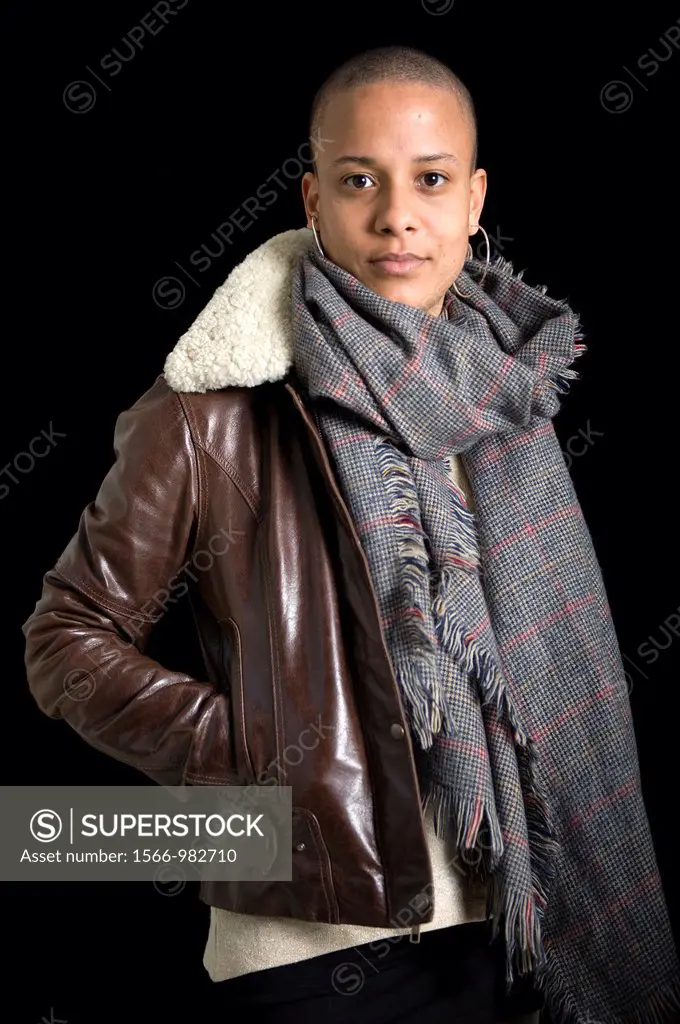 Portrait of a young, African immigrant to The Netherlands. This attractive woman has a caucasian Dutch father and a black African mother.