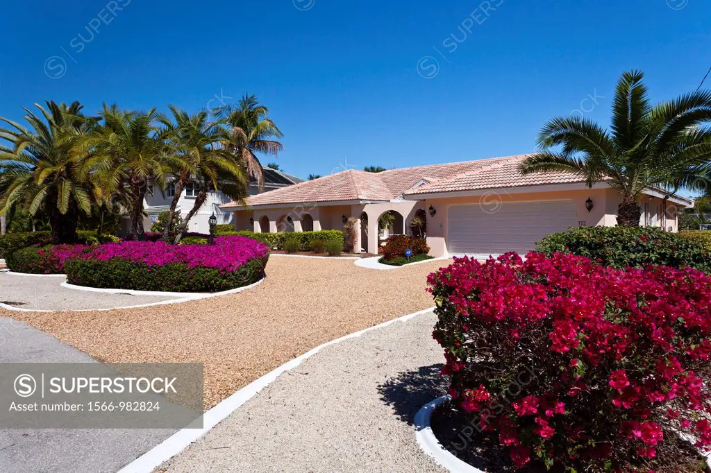 An island home with bougainvillea flowers on Sanibel Island, Florida, USA