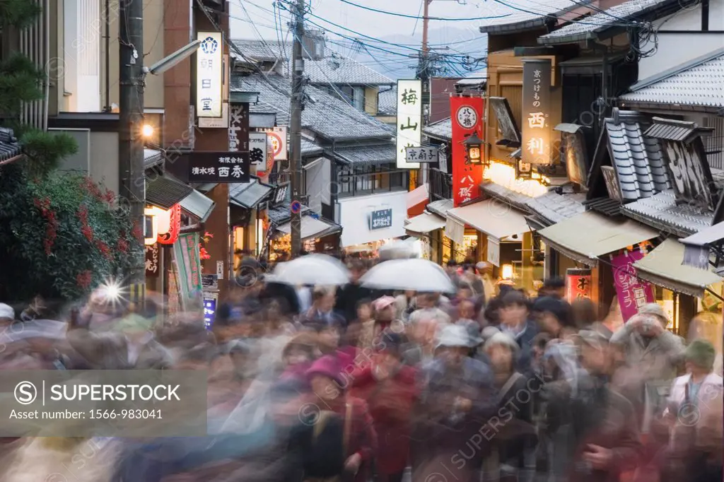 Tourists crowd the narrow streets below Kiyomizu-dera Temple in the Higashiyama district of Kyoto, Japan blurred motion