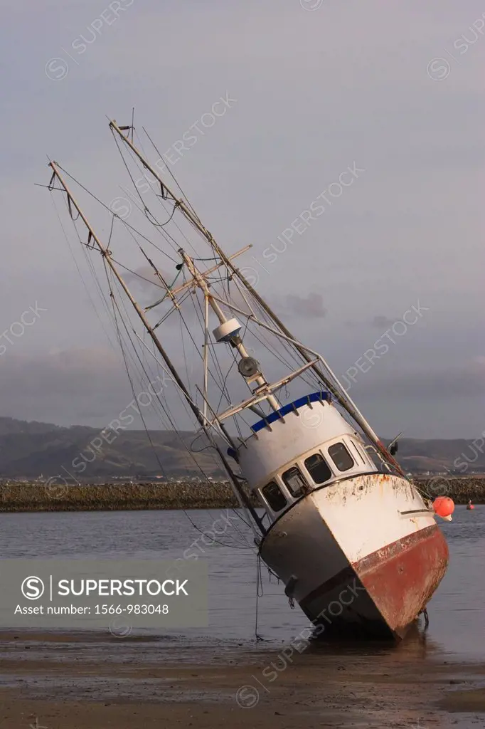 Stranded fishing boat at Pillar Point Harbor, Half Moon Bay, San Mateo County, California
