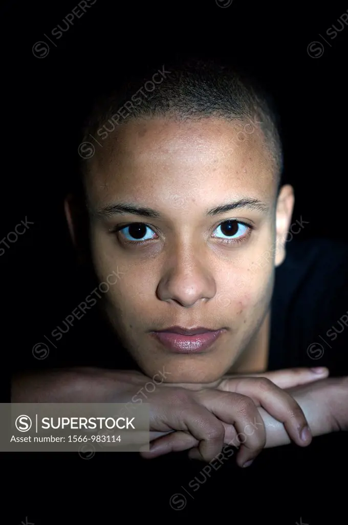 Portrait of a young, African immigrant to The Netherlands. This attractive woman has a caucasian Dutch father and a black African mother.