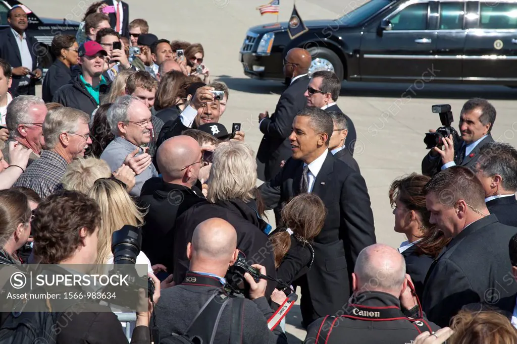 Detroit, Michigan - President Barack Obama greets a crowd of supporters upon arrival at Detroit Metro Airport on Air Force 1