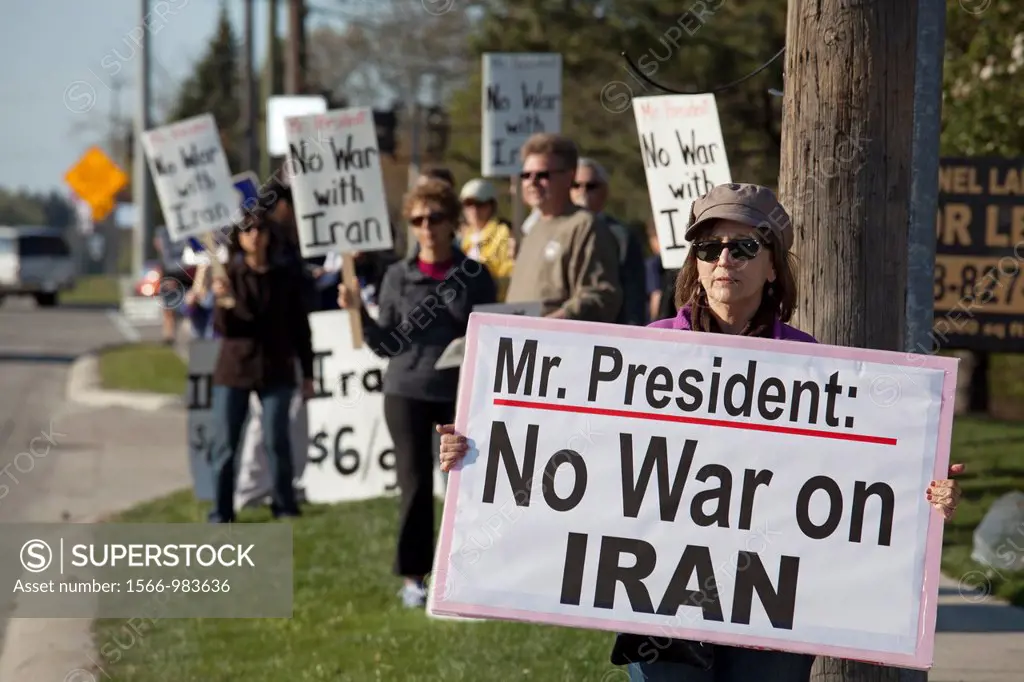 Bingham Farms, Michigan - Peace activists hold signs opposing war with Iran while waiting for President Obama´s motorcade to pass  The president was a...