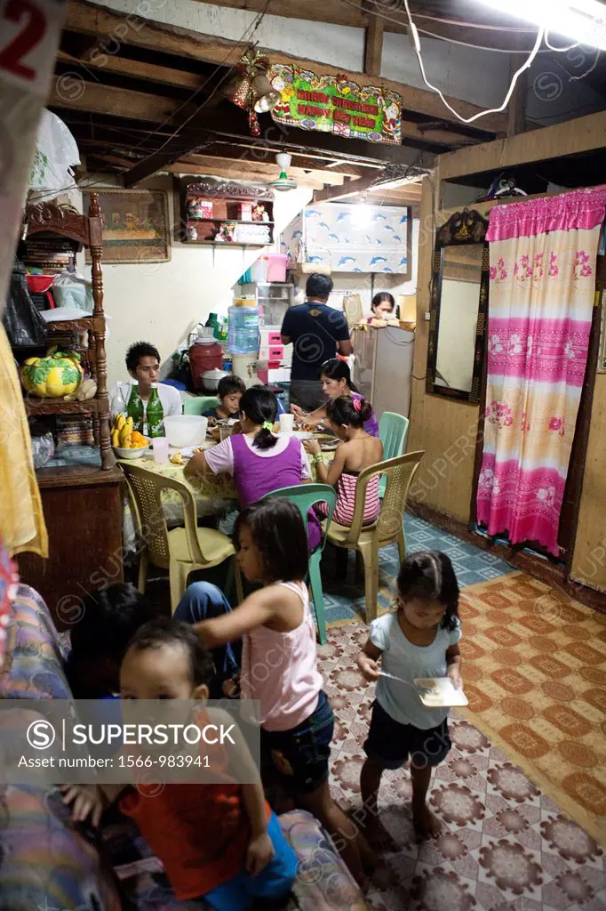Filipino family having dinner together at home  Lapu-Lapu City, Metro Cebu, Mactan Island, Visayas, Philippines