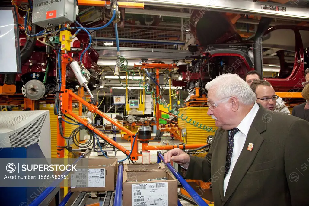 Detroit, Michigan - Lech Walesa inspects auto parts as he visits Chrysler´s Jefferson North Assembly Plant  Walesa was a founder of the Solidarity tra...