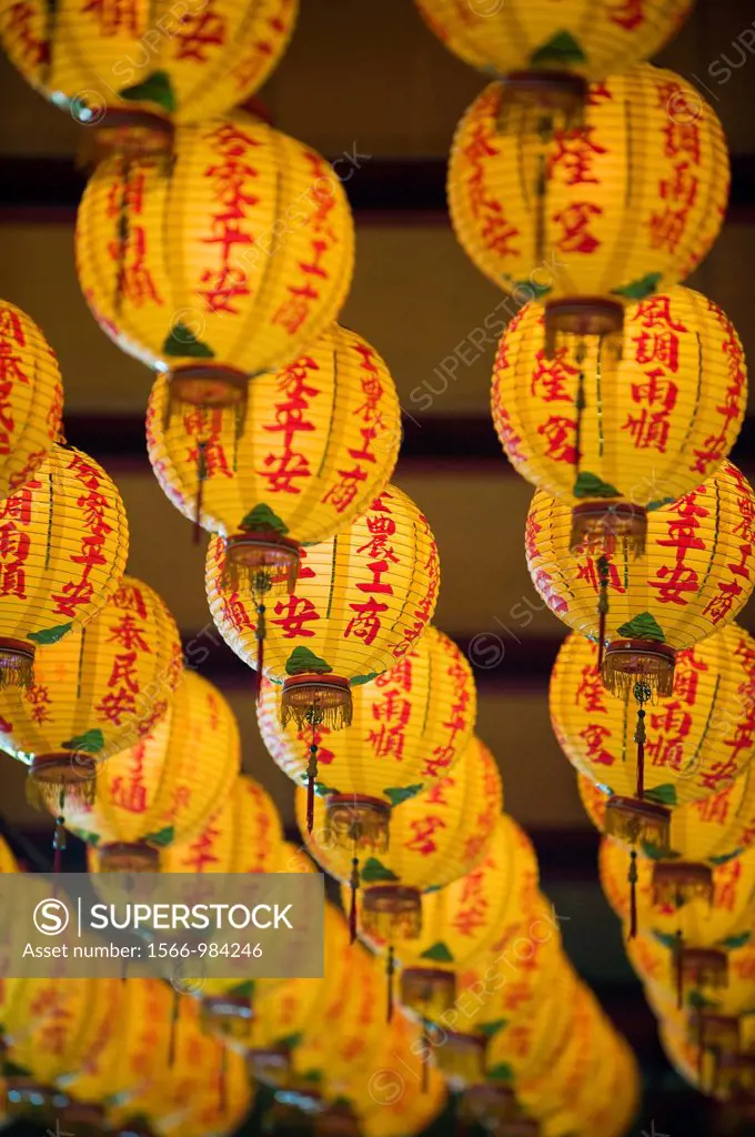 Yellow Chinese Lanterns hanging from the ceiling of a Daoist temple in Sanshia, Taiwan.