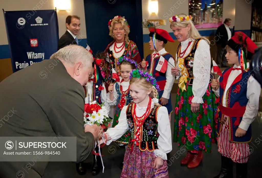 Detroit, Michigan - Meredith Bayus, 5, of the Zamek Dance Troupe hands flowers to Lech Walesa as he visits Chrysler´s Jefferson North Assembly Plant  ...